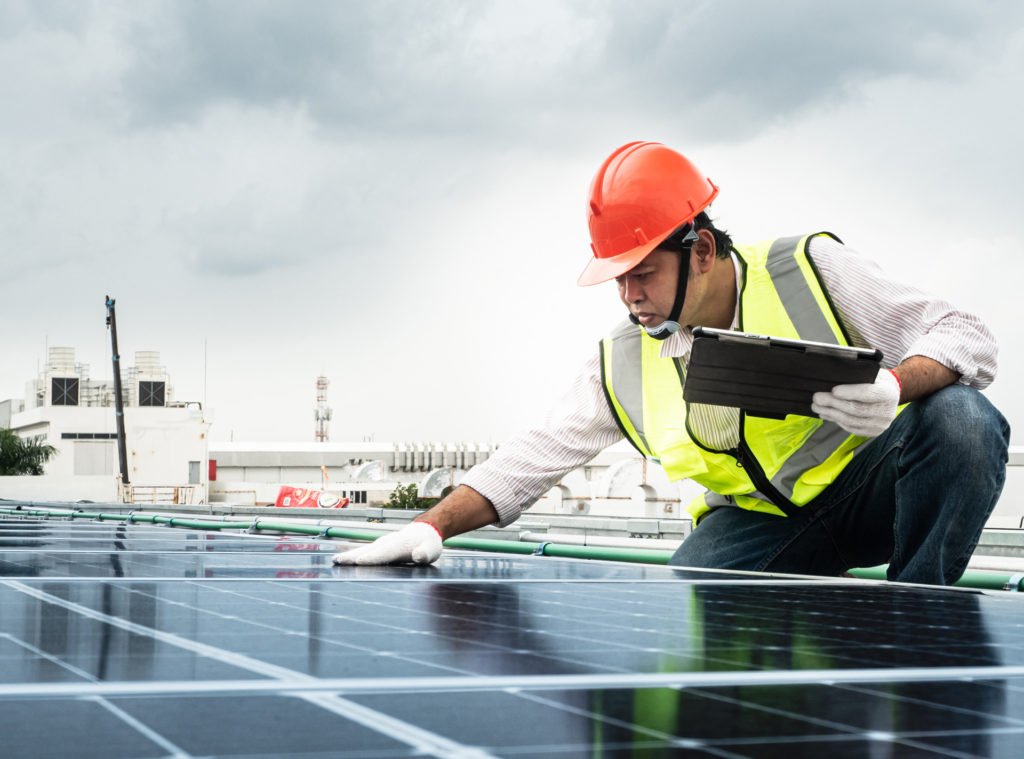 Engineer checking solar panels